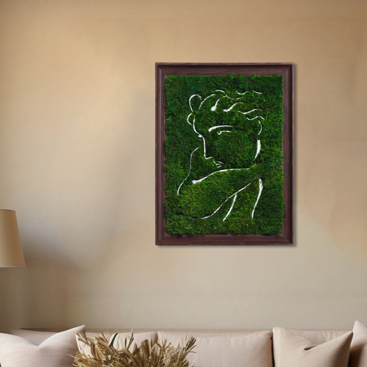 Framed Woman Profile Parisian Moss Wall Art combining lush Mood Moss and artistic portrait, displayed in a living room.