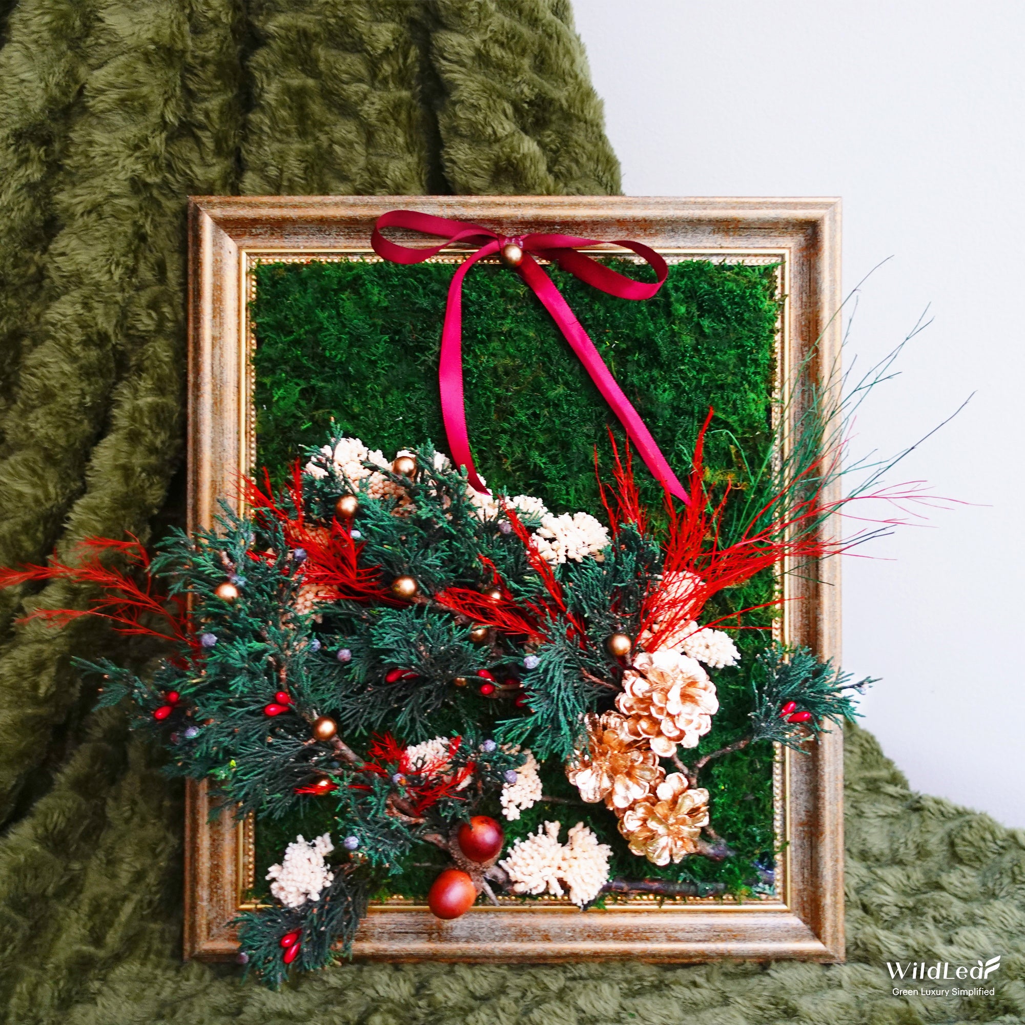 Antique Gold Framed Christmas Moss Wall Art on a green velvet table, featuring preserved moss and festive holiday decor.