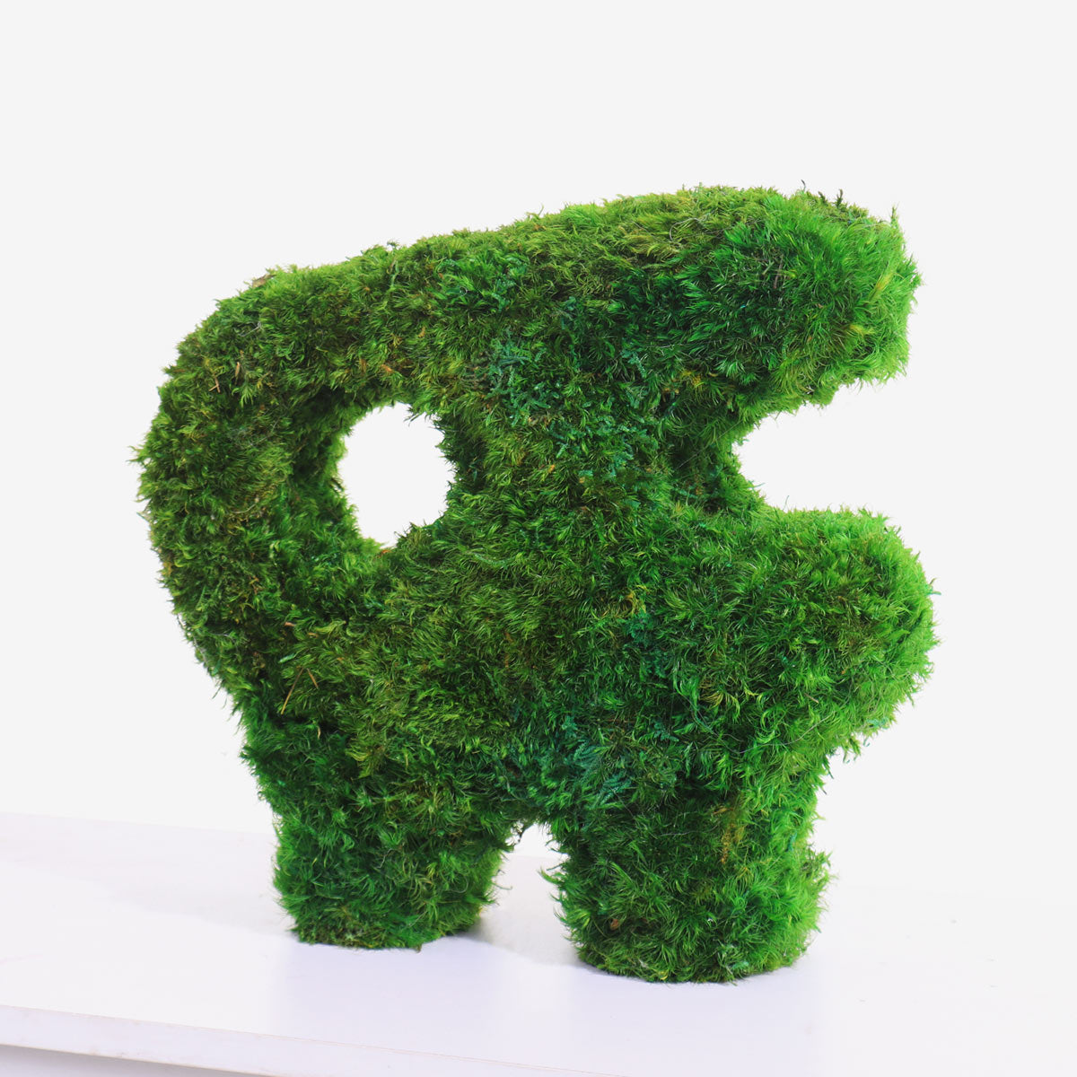 Side profile of Little Beast Sculptural Mood Moss Tabletop highlighting its unique totem-like shape.