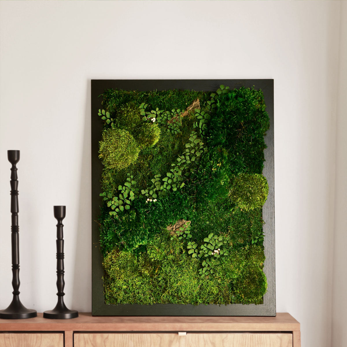 Forest moss wall art panels creating biophilic accent in office space