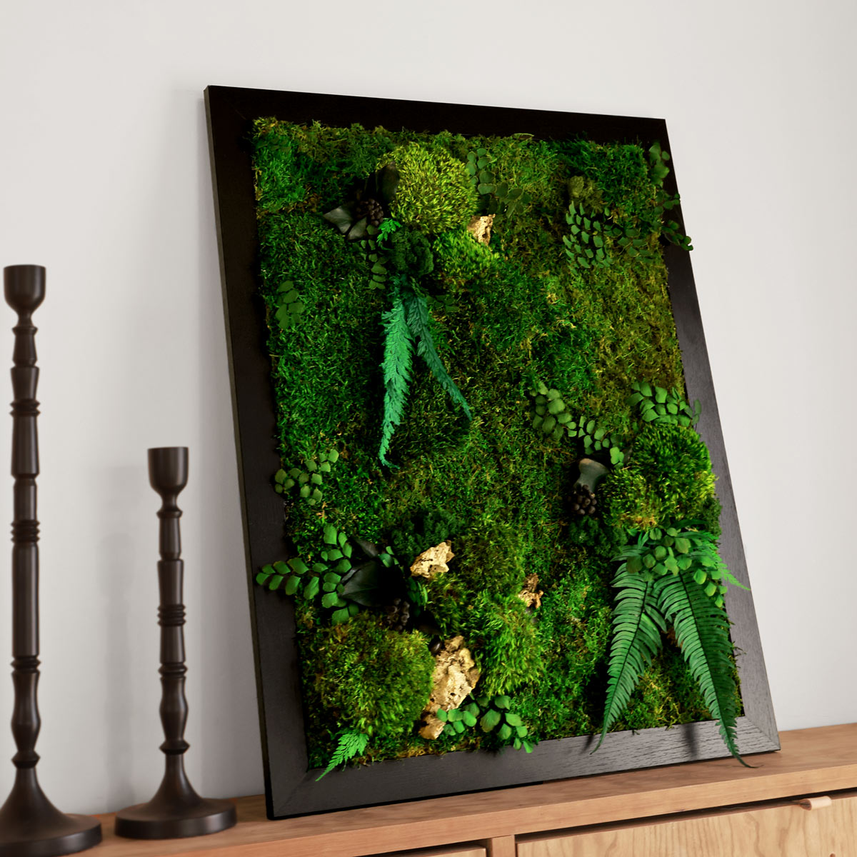 Forest moss wall art panels creating biophilic accent in entryway