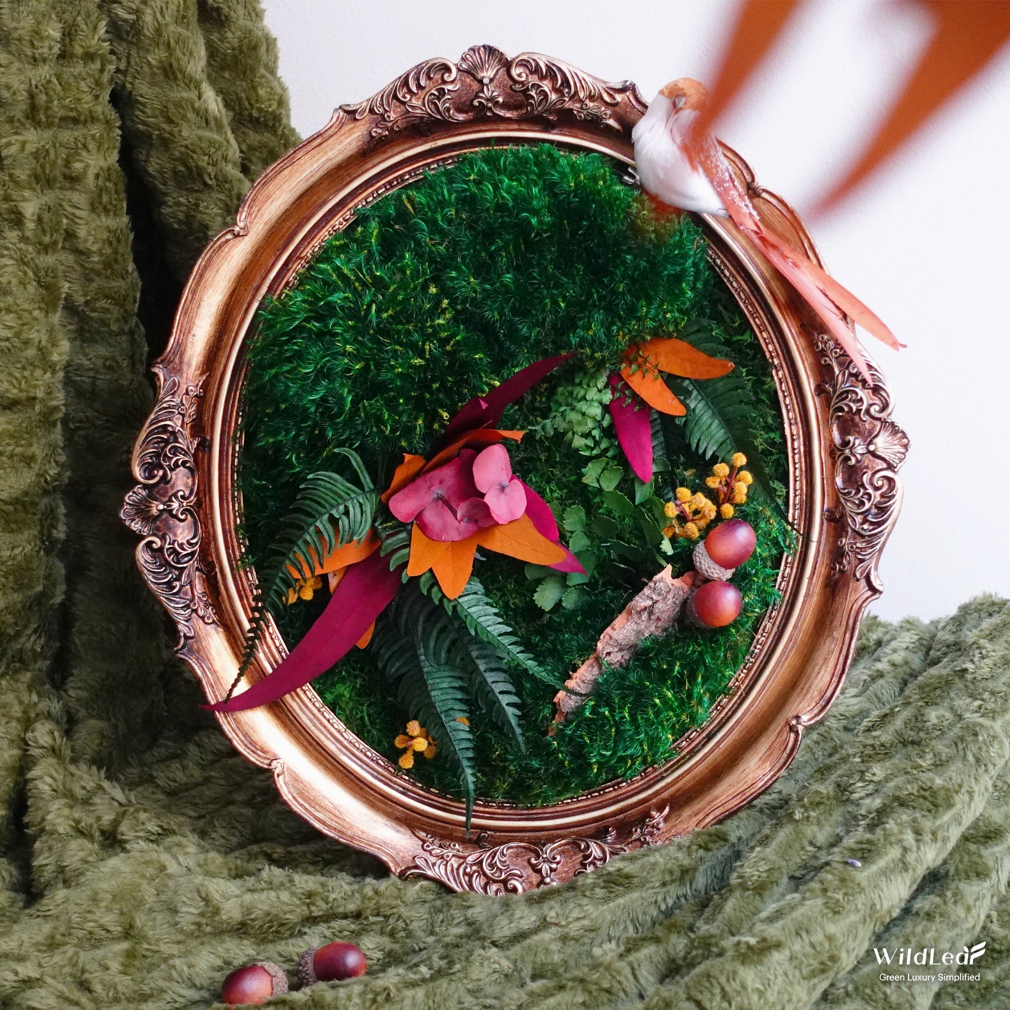 Vintage Oval Framed Fall Moss Wall Art displayed on a modern interior corner, adding autumn vibe to home.