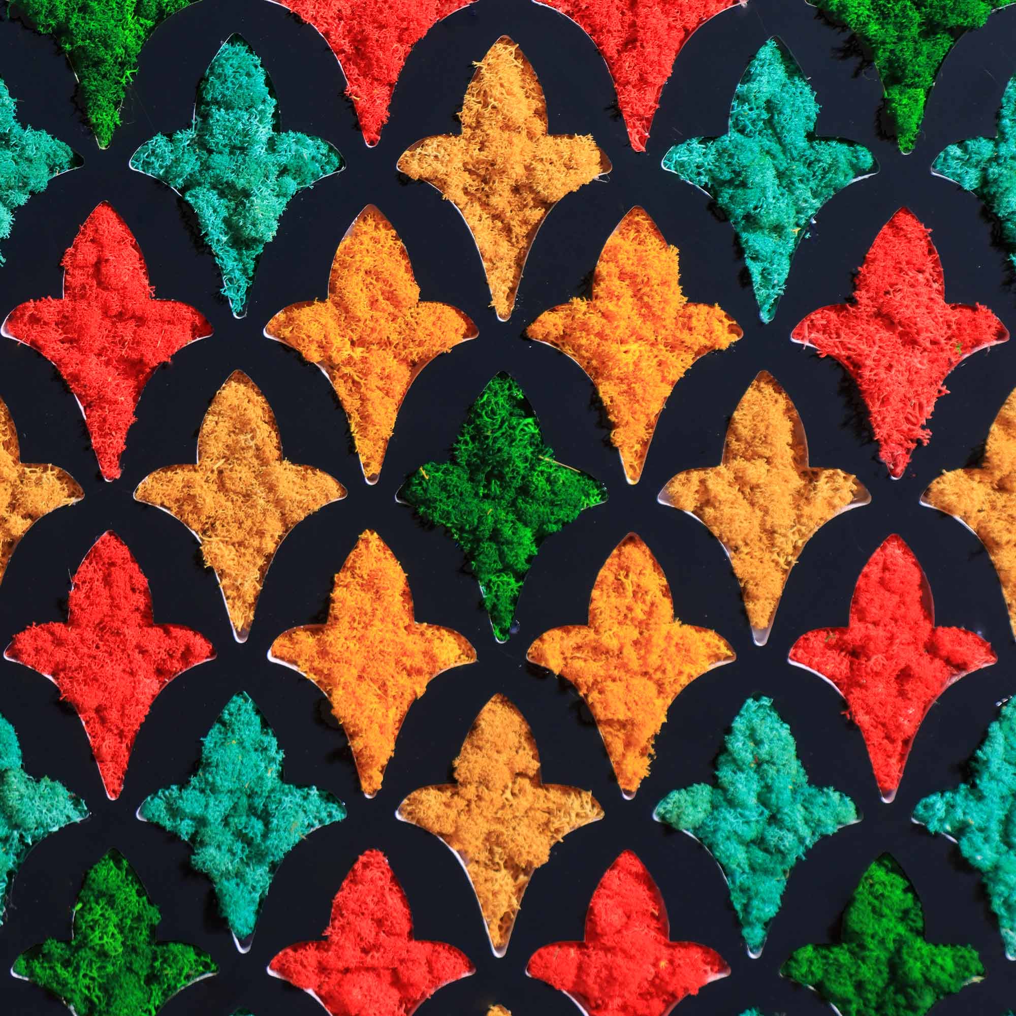 Close-up of PVC engraved Mashrabiya pattern with jewel tone reindeer moss
