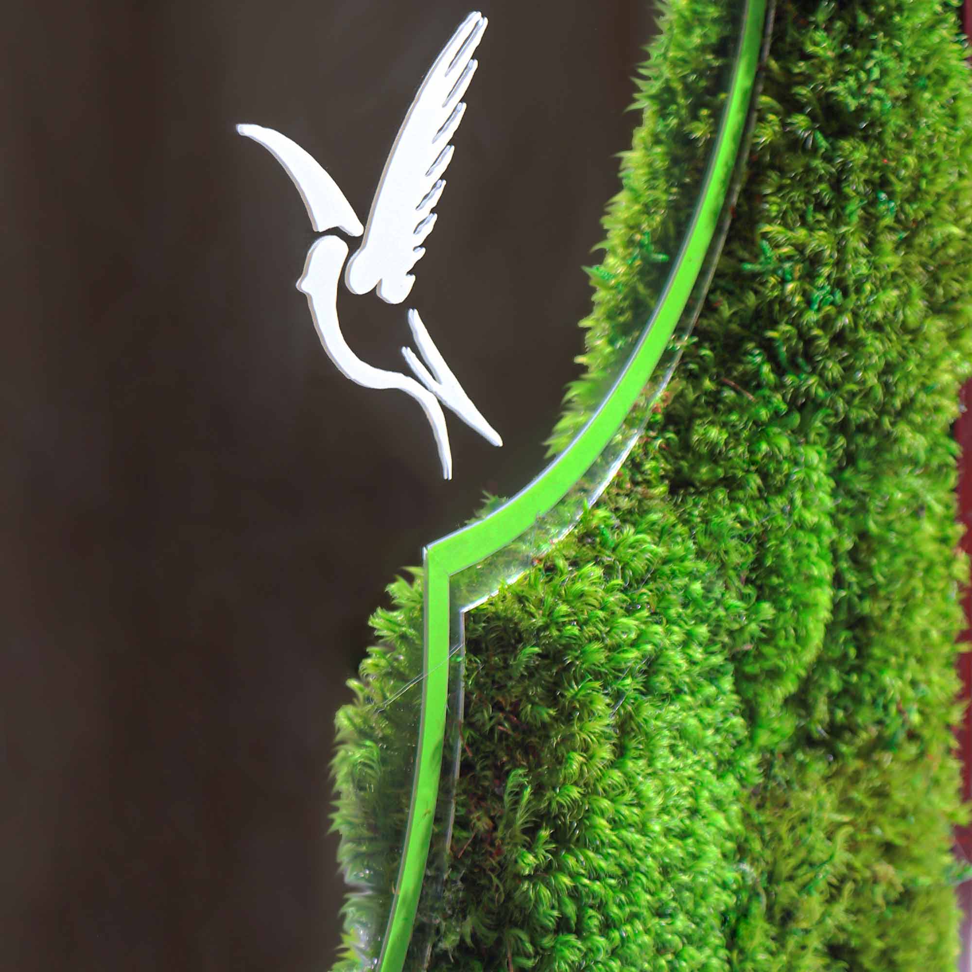 Close-up view of the bamboo groves and birds design on the mirror, with lush Mood Moss surrounding it.