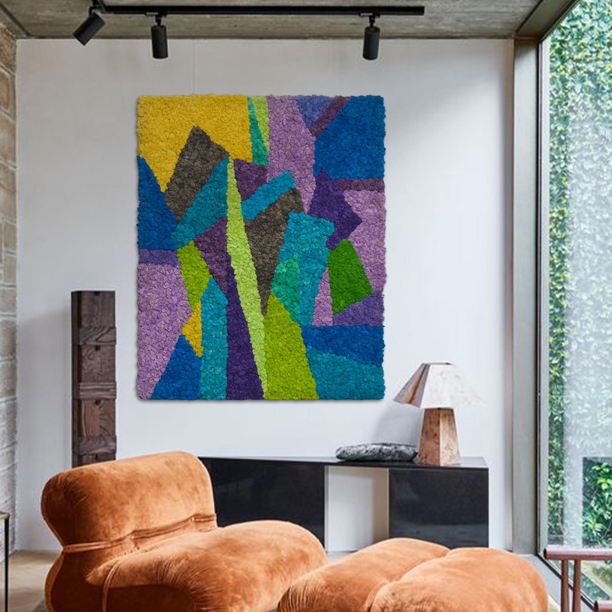 Abstract modern reindeer moss wall art in cool tones displayed in a contemporary living room, featuring layered geometric patterns in blue, green, and purple.