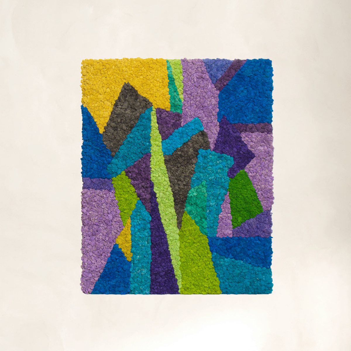 Abstract modern reindeer moss wall art in cool tones, showcasing geometric composition with blue, purple, green, and yellow moss sections.