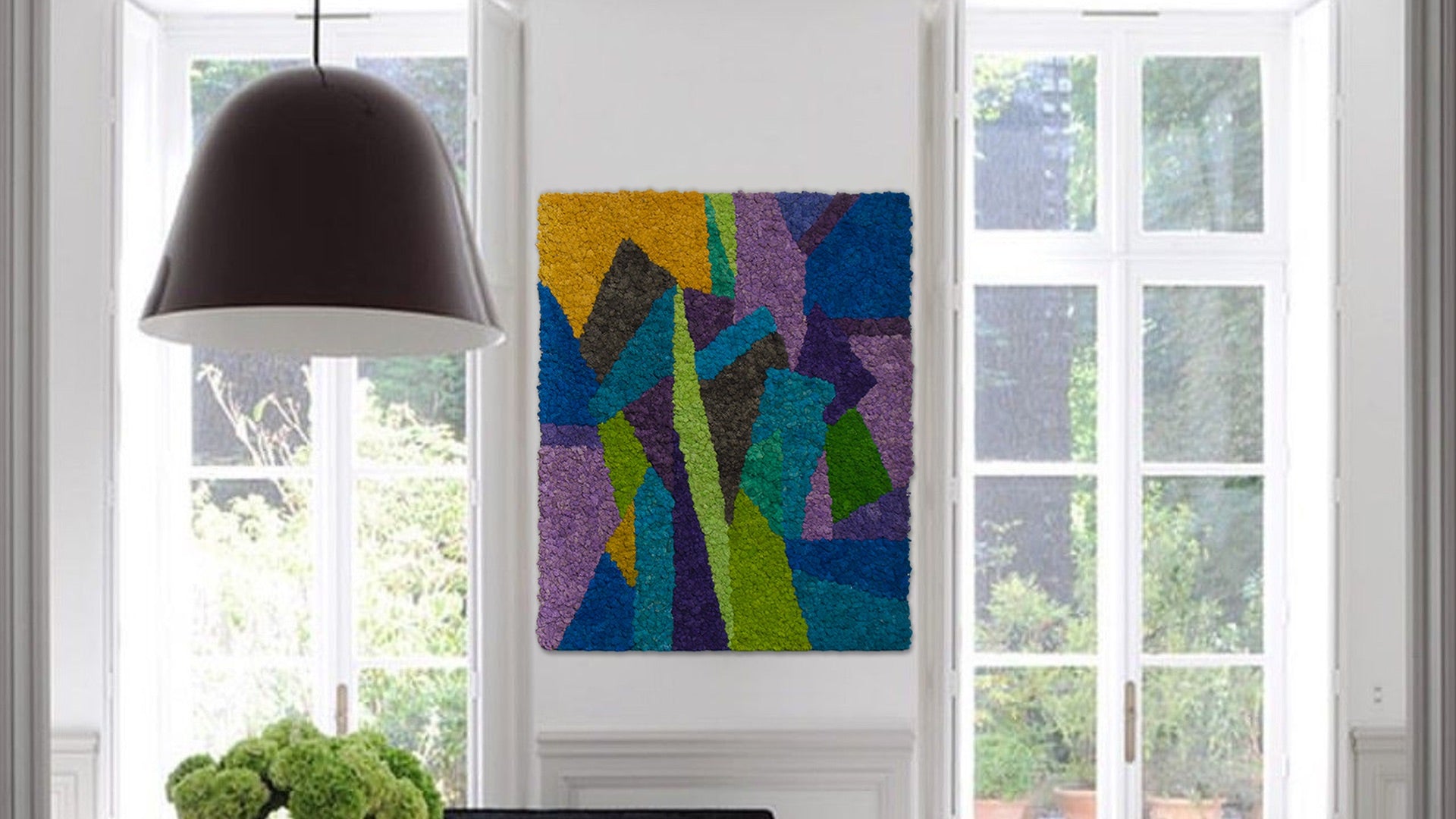 Abstract reindeer moss wall art in cool tones, featuring geometric color fields in blue, green, and purple, installed as a biophilic feature wall in home interior.