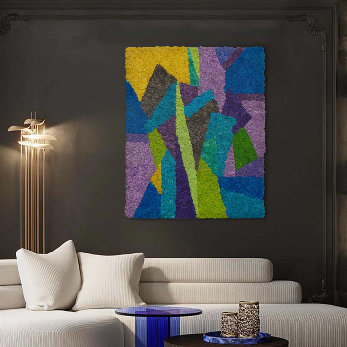 Cool-tone abstract reindeer moss wall art mounted on a dark feature wall, showcasing bold geometric forms and preserved moss texture in a modern interior setting.
