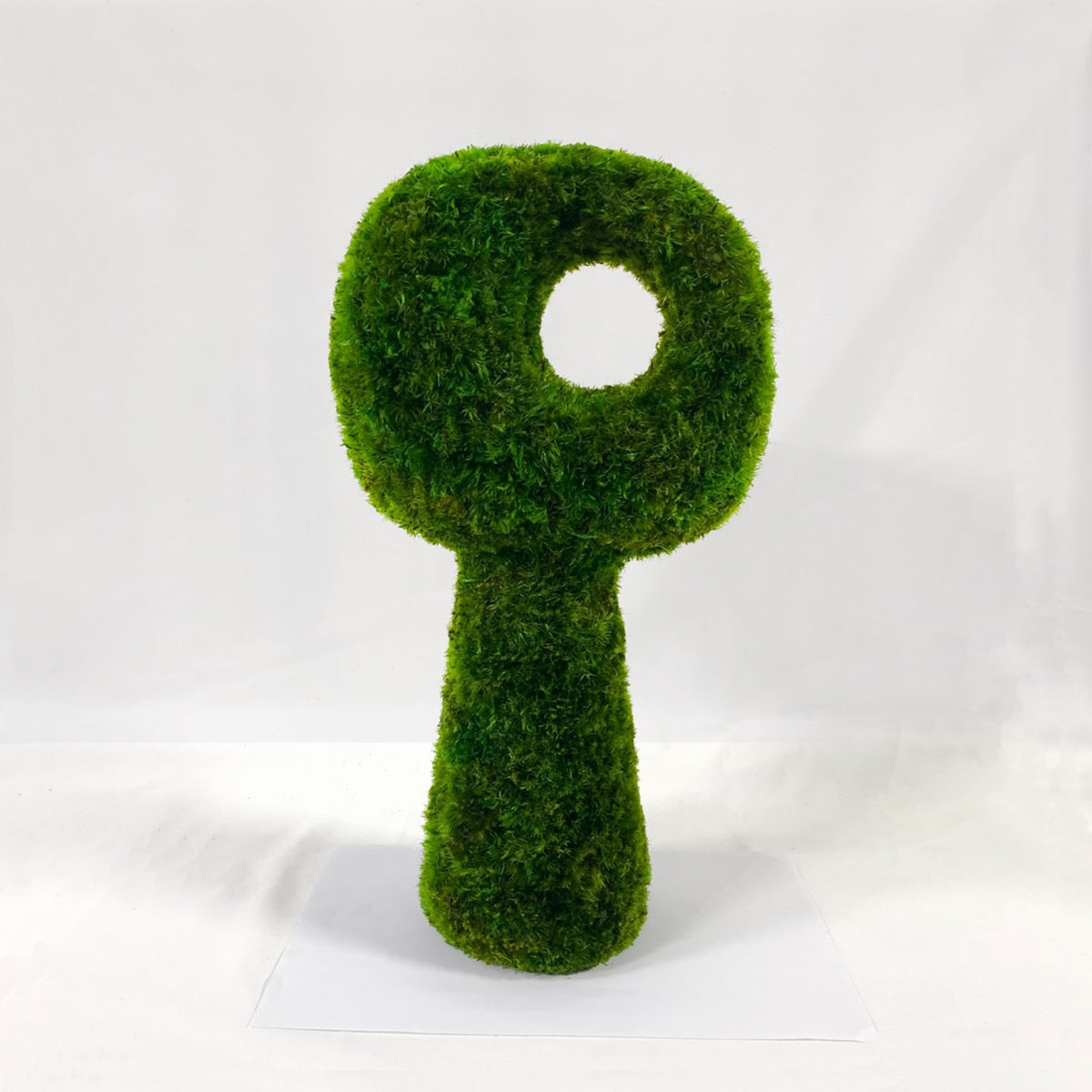 Majestic Warden sculptural moss tabletop object crafted from preserved green moss, minimalist organic form on white background.