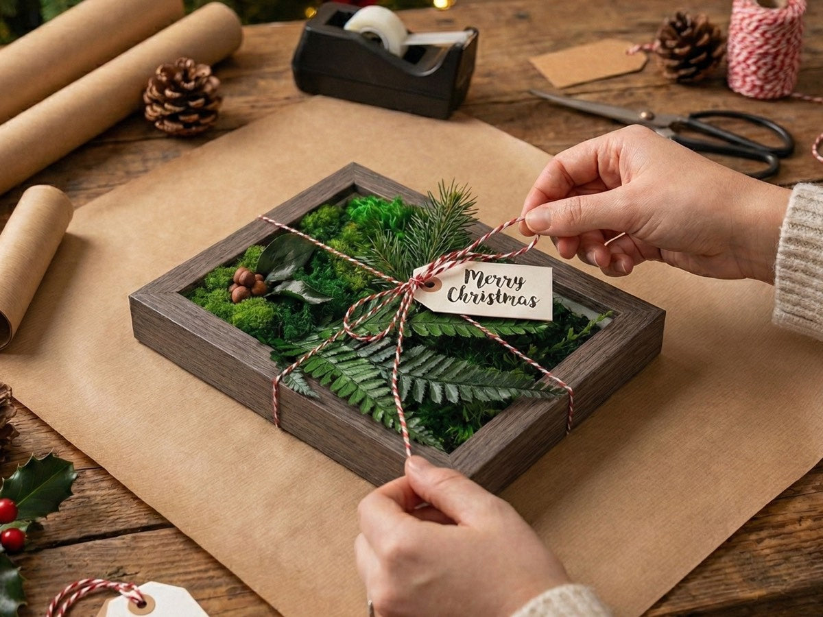 Preserved moss frame wrapped as a holiday gift with natural greenery and handmade packaging