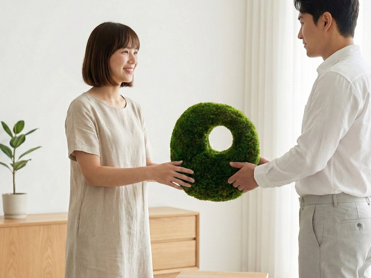 Preserved moss tabletop sculpture being gifted at home, a long-lasting natural decor gift with no maintenance.