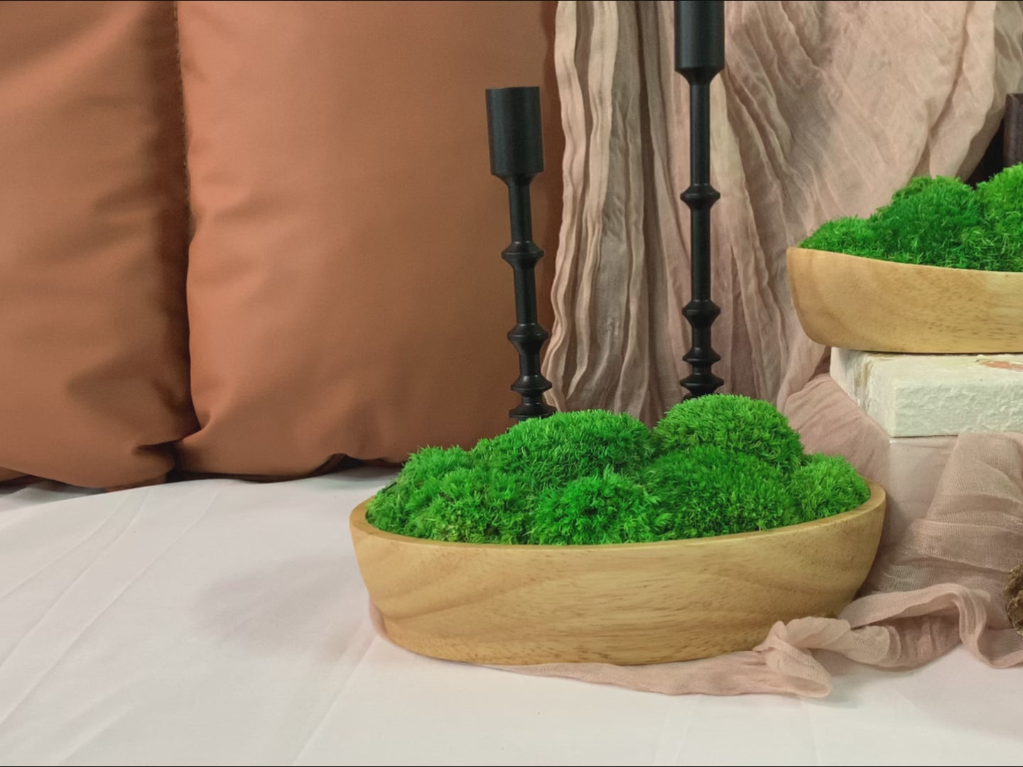 Video presentation of Boat Shape Wood Moss Bowls, showcasing lush green moss in a natural wooden bowl with a candlestick background.